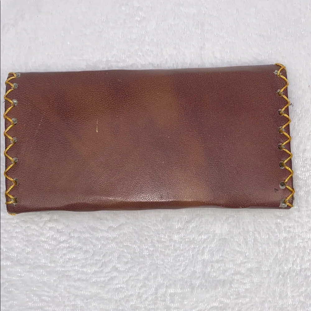 Brown and Yellow Wallet with Decorative Medallion